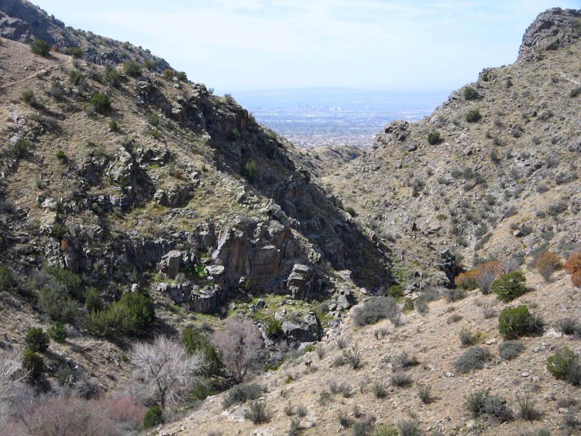 Downtown Albuquerque visible through the mouth of Juan Tabo Canyon.