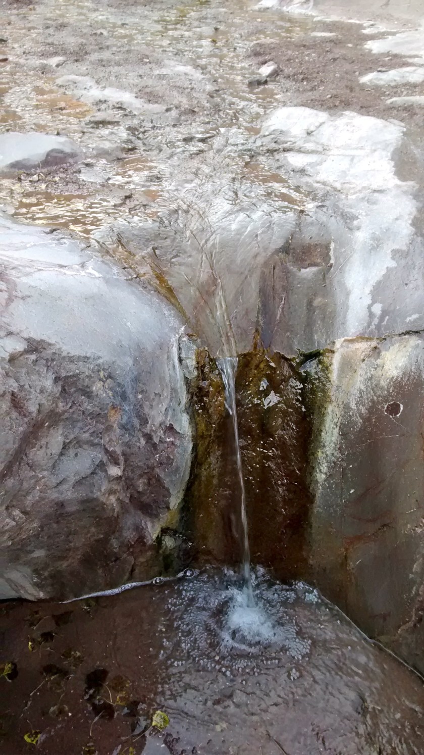 Stream makes a waterfall.  Size is deceptive.  It was less than a foot high.