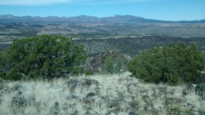 View west to Los Alamos, Pajarito Plateau, and Jemez Mountains.