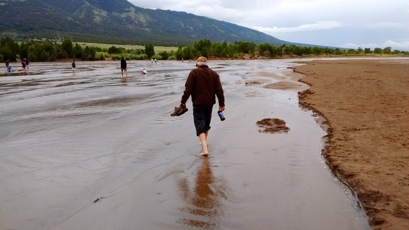 The only way to get to the dunes was to wade across Medano Creek.  This is wading back across to the visitor center after we climbed the dunes.