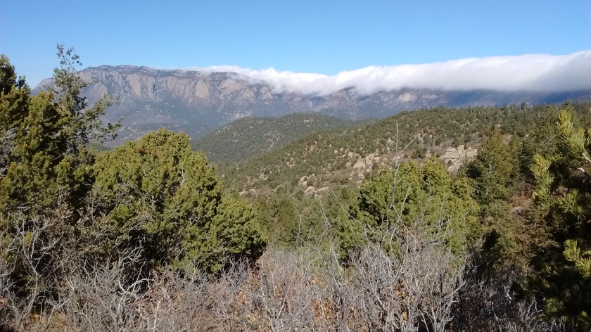 South Sandia Peak shrouded in clouds behind us viewed from Whitewash Trail.