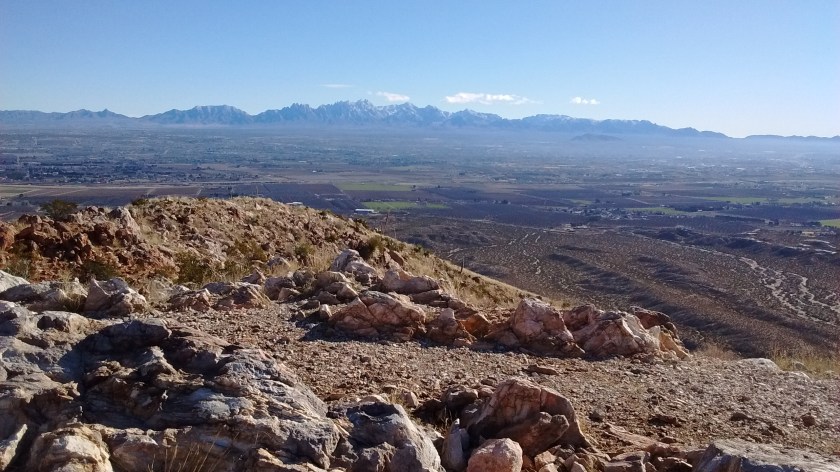 View from the top looking southeast towards Las Cruces. Organ Mountains in the distance.